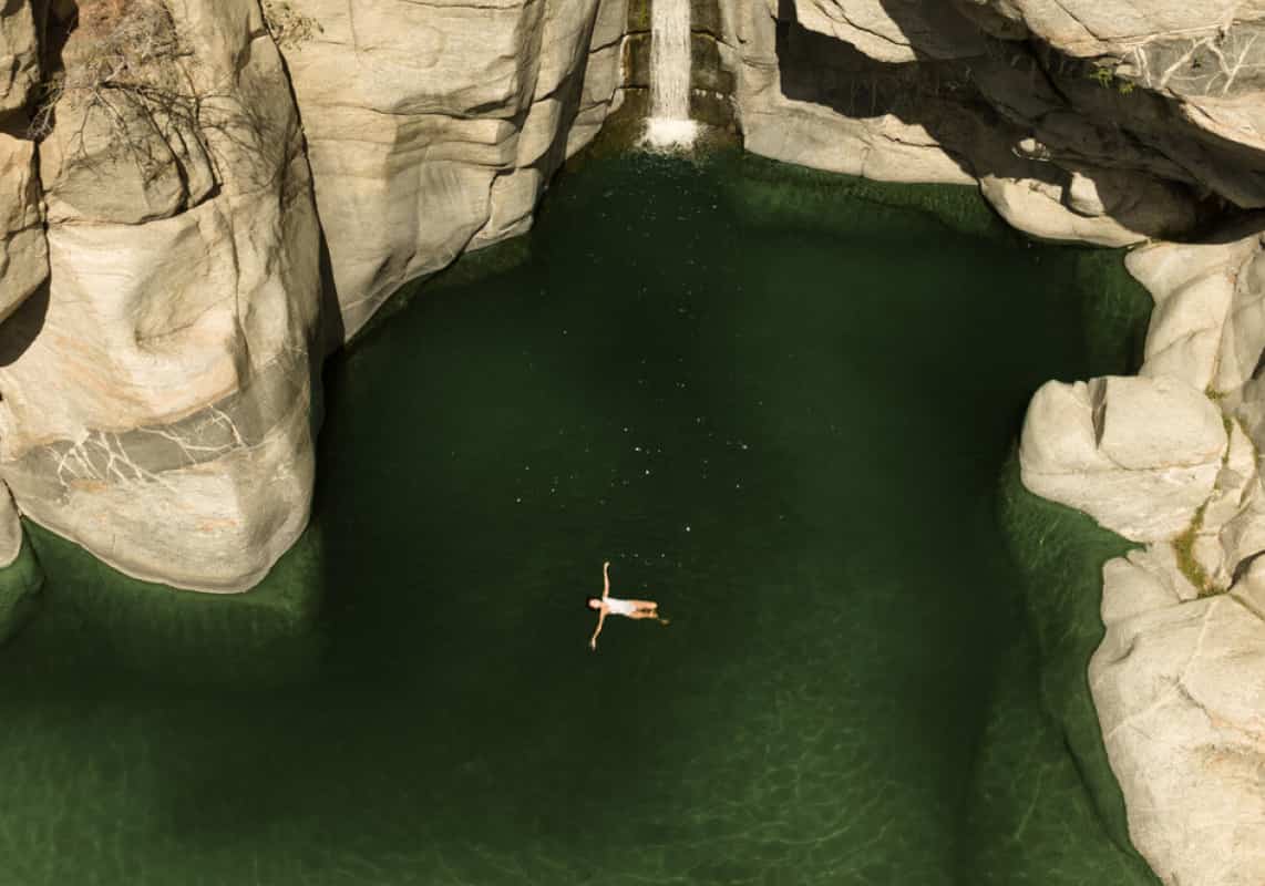 Sitting in hanging chair by the beach